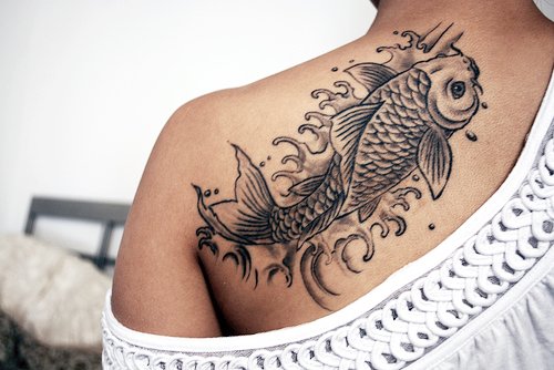 Black And White Fish Tattoo On Left Back Shoulder